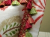 Close up of Floral Pillow with Flange edge and tassel Trim