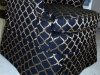 wingback-chair-slipcovered-in-black-fabric-with-a-long-pleated-skirt