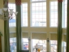 2-story-window-treatment-with-panels-and-simple-rounded-banner-valances