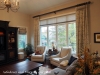 Euro Pleated Drapes on Custom Decorative Rod with large Band on lower hem and Matching Roman Shades