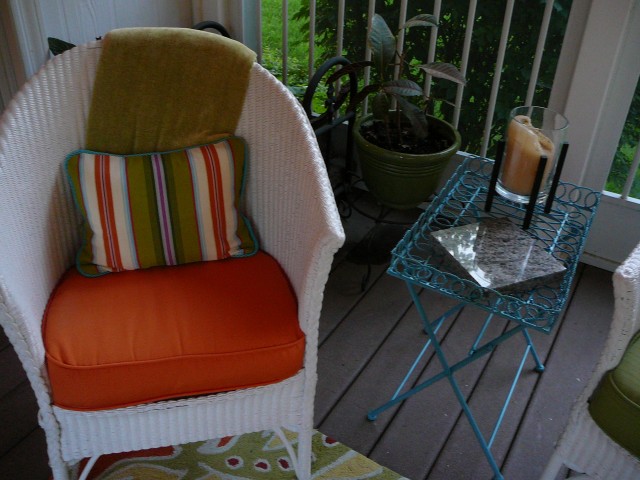 Wicker chair, blue table, cushions