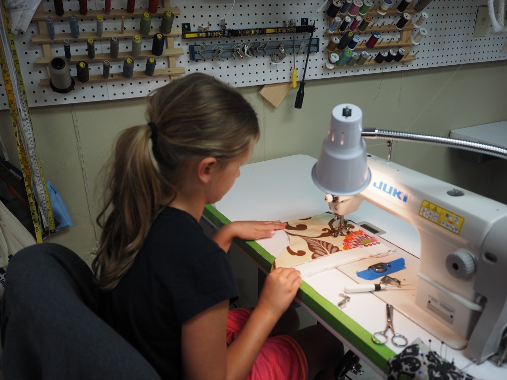 4-Her's practicing on industrial sewing machine